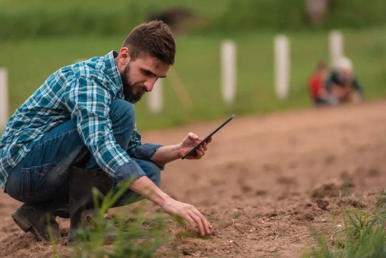 Image of a man inspecting soil