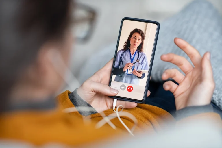 A person speaking to a doctor via a video call on their phone. The image accompanying GrantTree's blog about Innovate UK's Investor Partnerships competition.