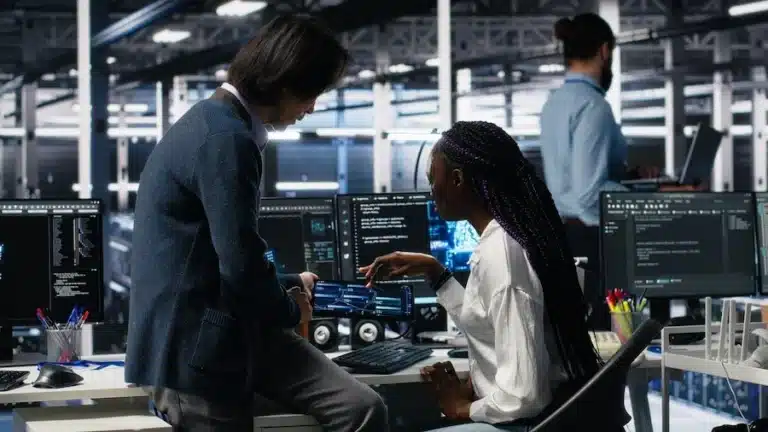 Two software engineers working on an AI project