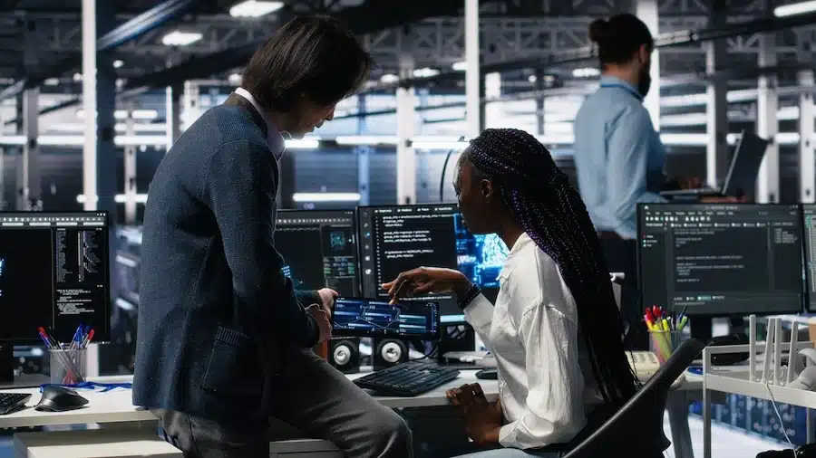 Two software engineers working on an AI project