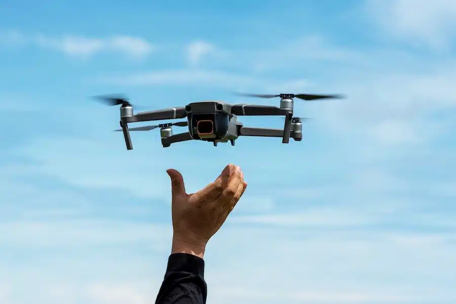 An image of a drone lifting off from someone's hand. Accompanies GrantTree's blog on the Innovate UK competition, 'Dual-Use Aviation Systems and Autonomy'