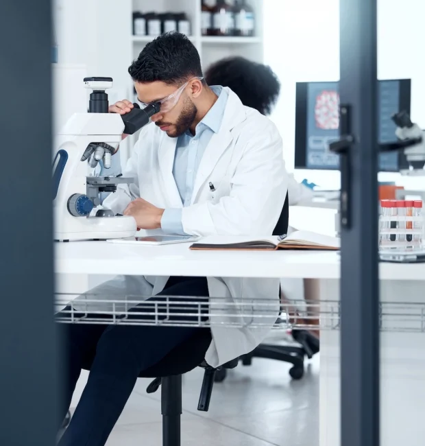 Scientist looking in a microscope
